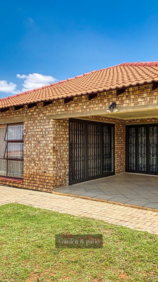 Vertical sample frame: a brick house with a patio, captioned Garden and patio.